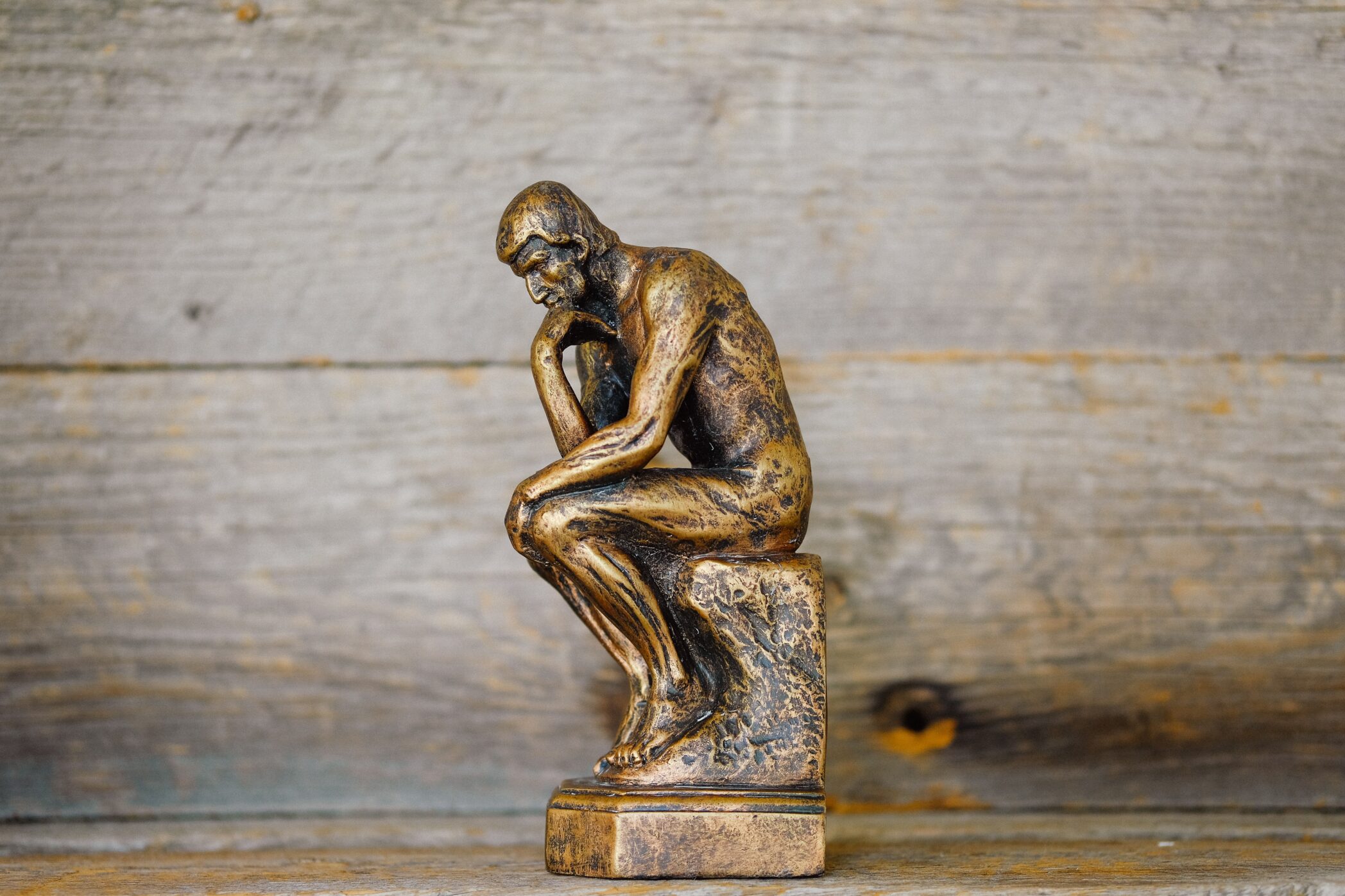 Small bronze sculpture in the style of "The Thinker"